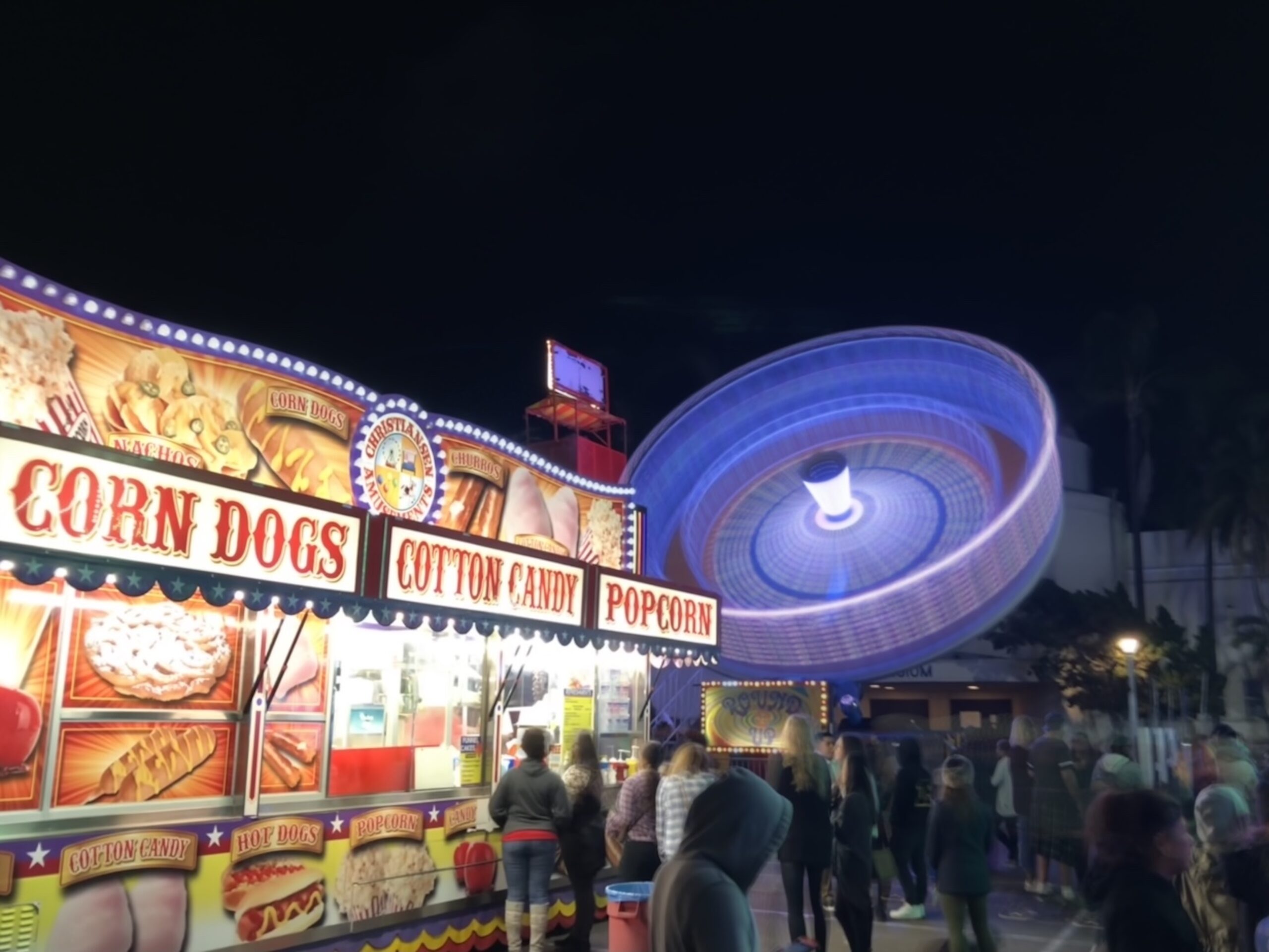 Night carnival ride glowing with color and motion.